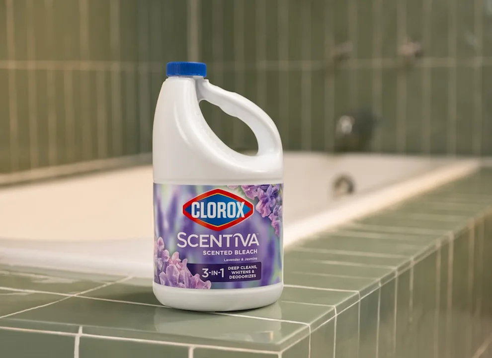 Plastic bottle of Scentiva Bleach sitting on the edge of a bathtub
