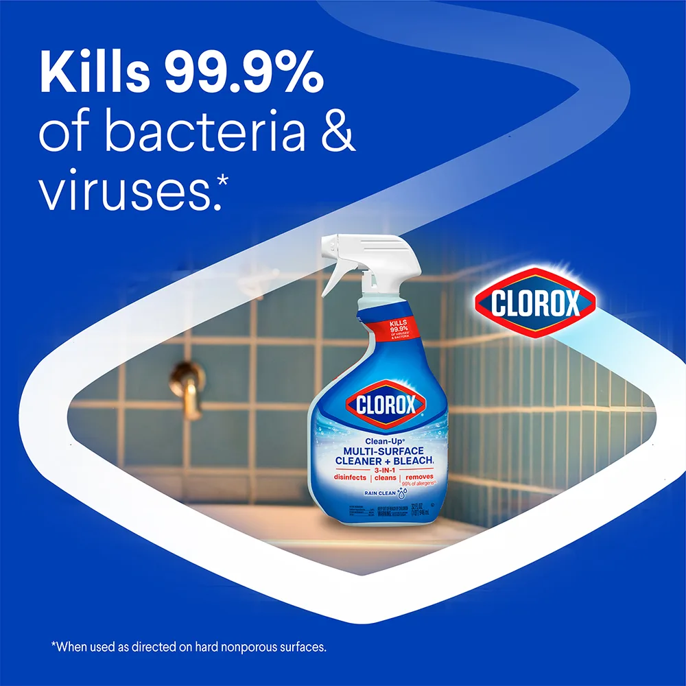 Kills 99.9% of bacteria & viruses, Clean-Up spray bottle on tile with blue background and white chevron