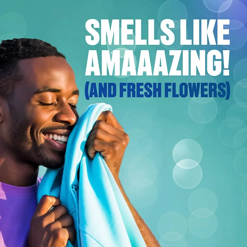 The words "Smells like amaaaaazing (and fresh flowers) next to a man smelling a freshly dried piece of clothing