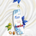 Suprême Colour Protect Shampoo, surrounded by olives and argan seeds