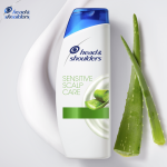 Sensitive Scalp Shampoo bottle, aloe leaves on the right side of the bottle.  