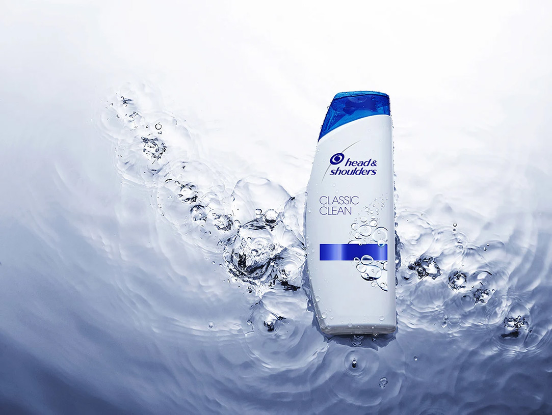 Head & Shoulders Classic Clean bottle on the water surface. 