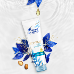 Suprême Purify and Volume Hair Conditioner, surrounded by argan seeds