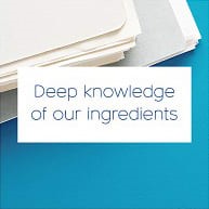 Part of papers file lying on the blue base and the text 'Deep knowledge of our ingredients' on white square.