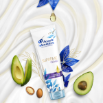 Supreme Damage Hair Conditioner, surrounded by avocado and argan seeds