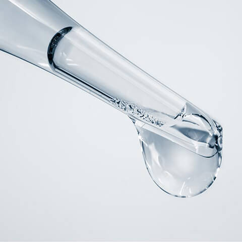 a drop of clear liquid on the pipette