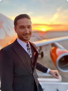 easyJet cabin crew by sunset with plane