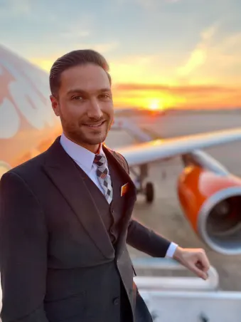 easyJet cabin crew by sunset with plane
