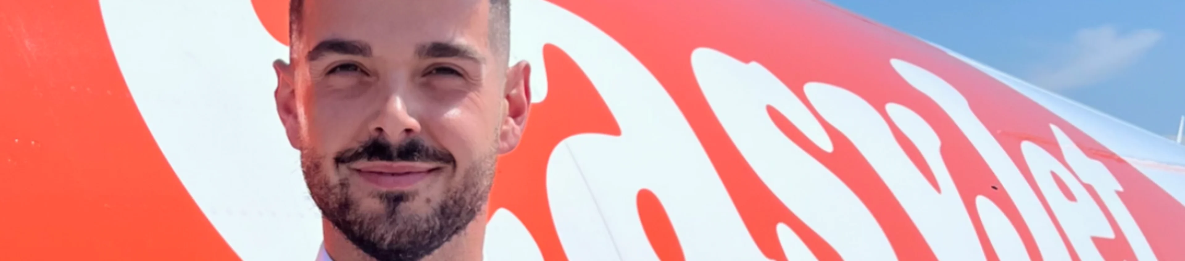 M1 easyJet cabin crew member by plane