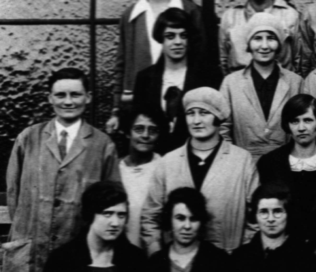 Closeup of a group photograph of the Monotype Matrix Factory and TDO staff. Dora Pritchett is probably the woman with glasses standing next to the man with a tie, second from the left. © Monotype archives