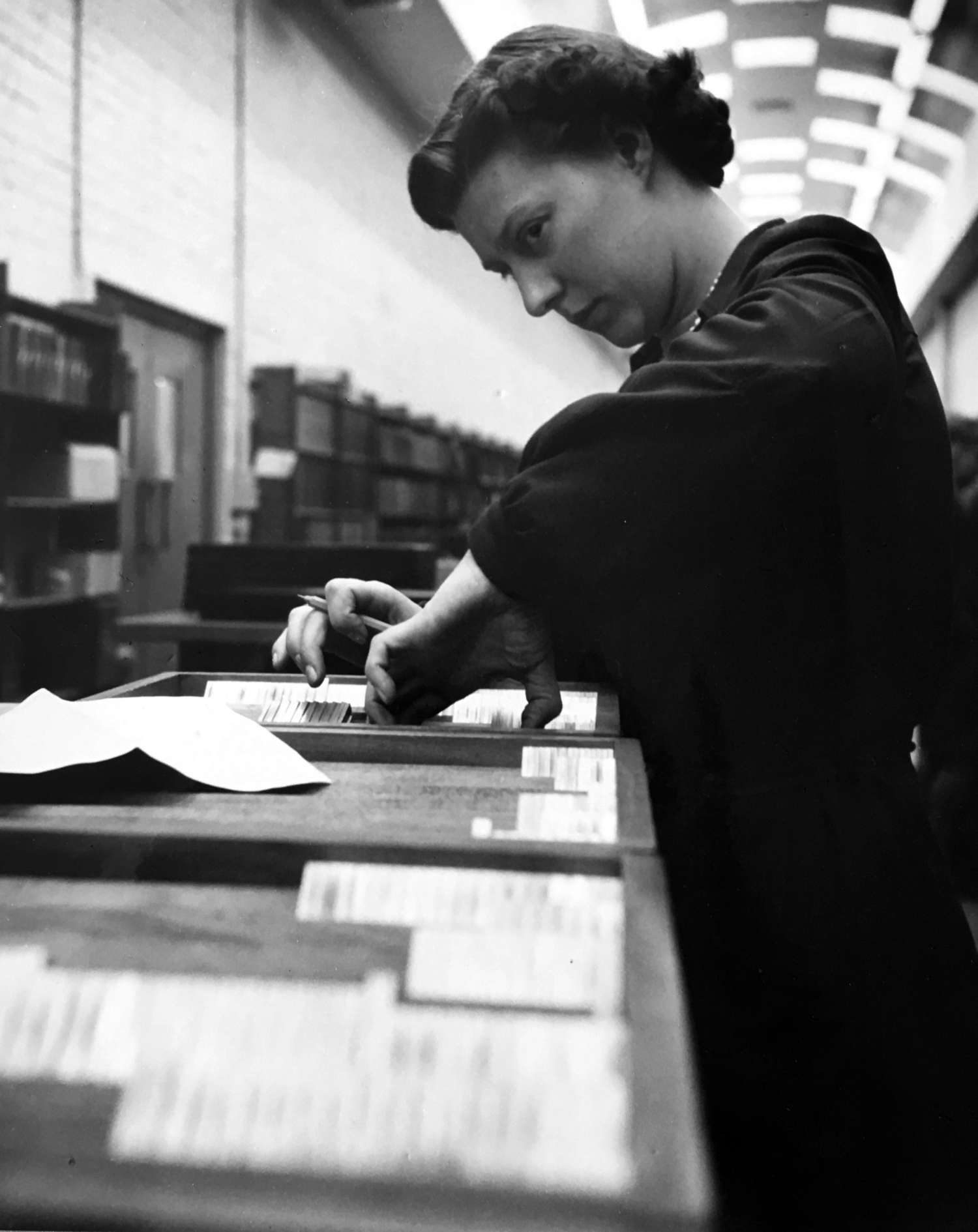 A Monotype employee preparing matrix orders, undated photograph. Courtesy Richard Cooper