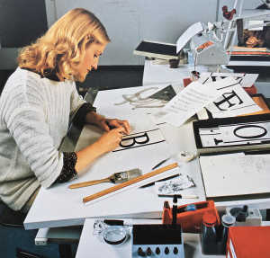 An employee of the German type manufacturing company Berthold completing a letter drawing for type production, early 1980s