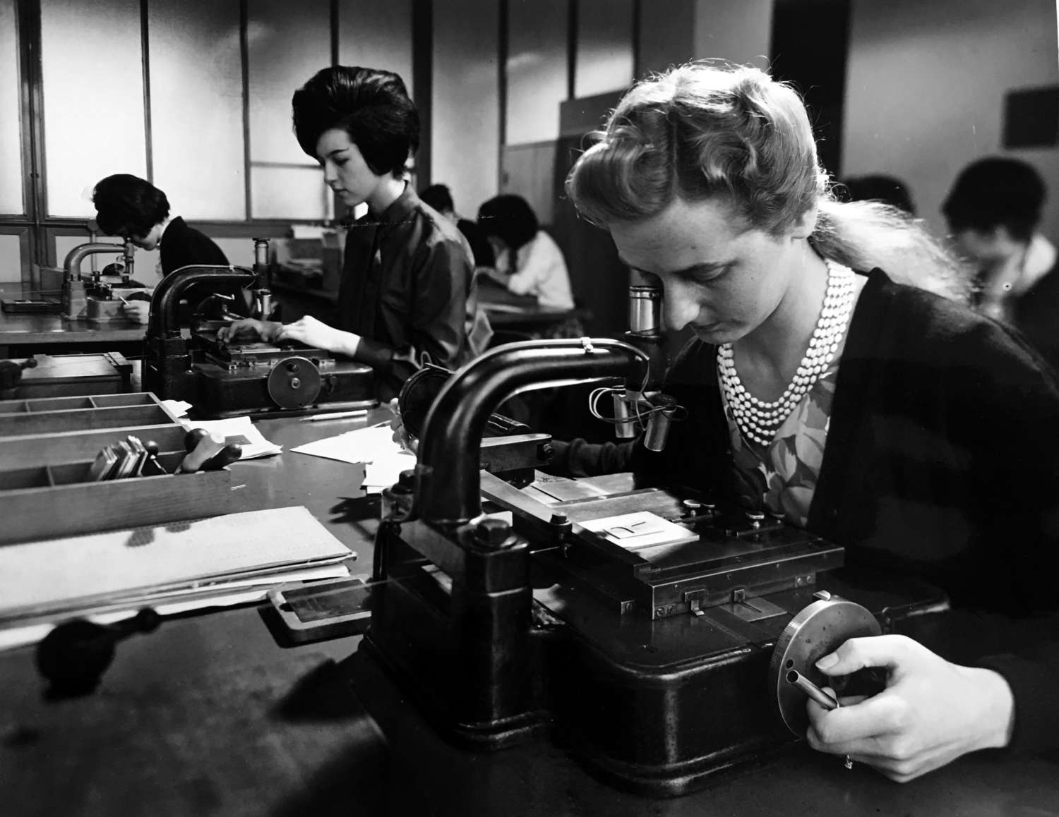 Monotype employees checking the accuracy of copper patterns used in the production of hot-metal matrices, undated photograph. Courtesy Richard Cooper