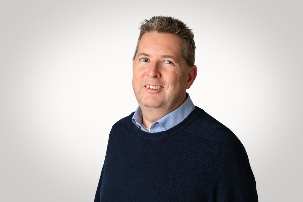 Airport Dimensions, Business headshot in shirt and jumper