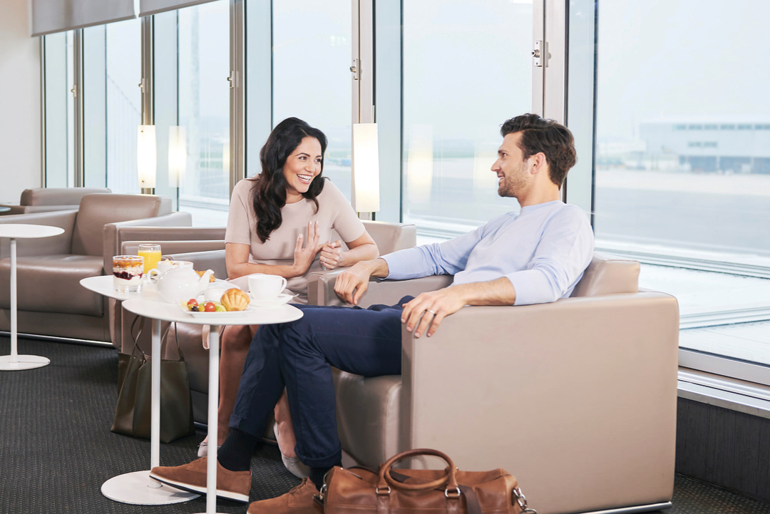 Couple sitting in airport lounge