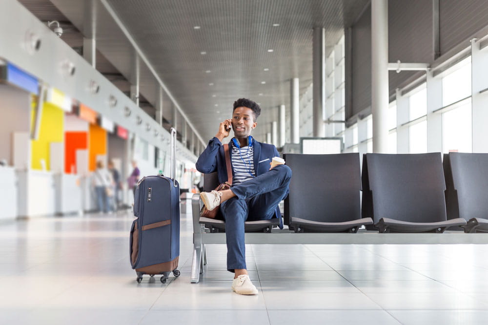 Person waiting for flight in airport lounge