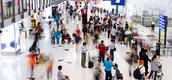 Airport terminal with travelers 