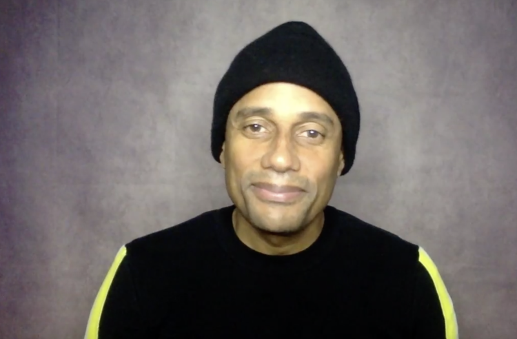 actor Hill Harper in front of plain background