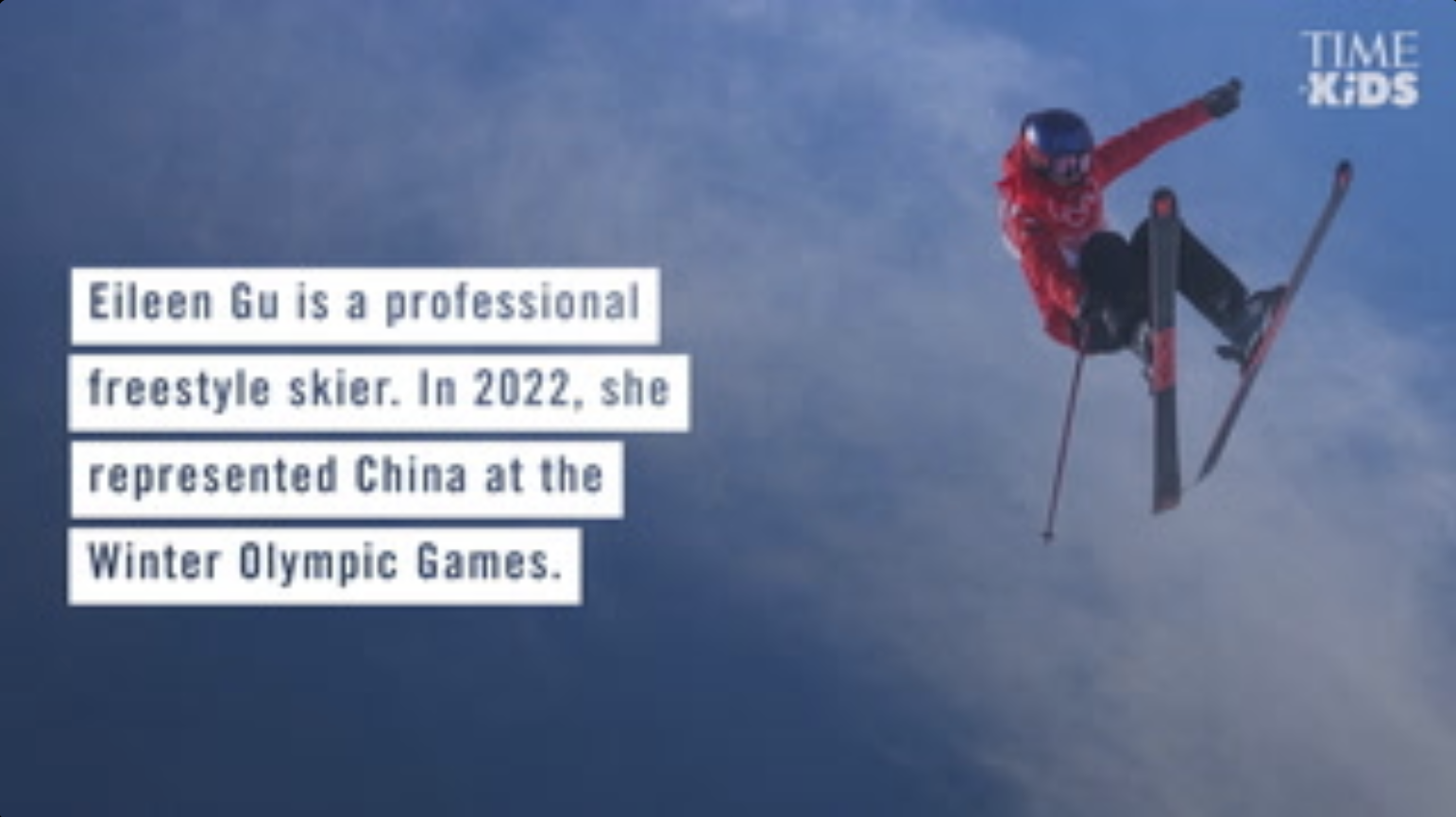Photo of Eileen Gu airborne on her skis on the right with a caption overlay to the left that reads, "Eileen Gu is a professional freestyle skier. In 2022, she represented China at the Winter Olympic Games."