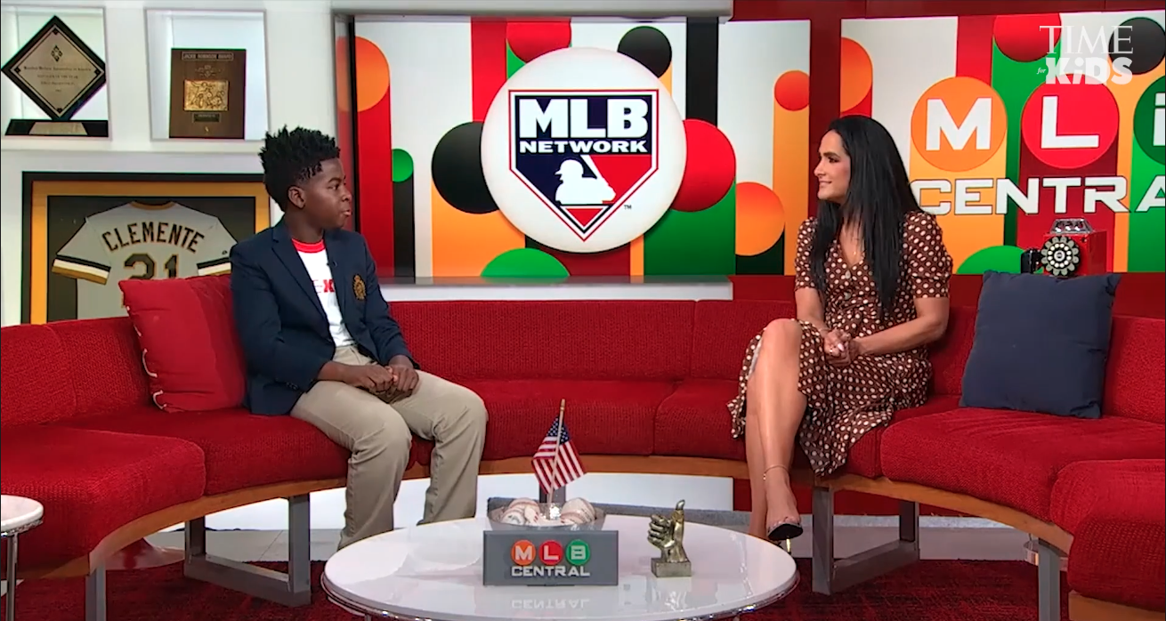 A boy and young woman on the set of MLB Network's show, MLB Central