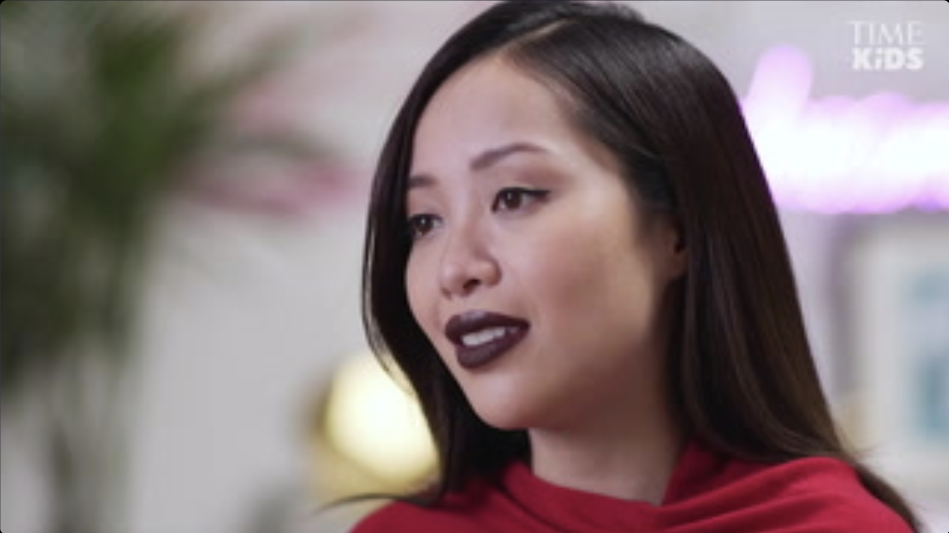 Still of Michelle Phan speaking about her brand.