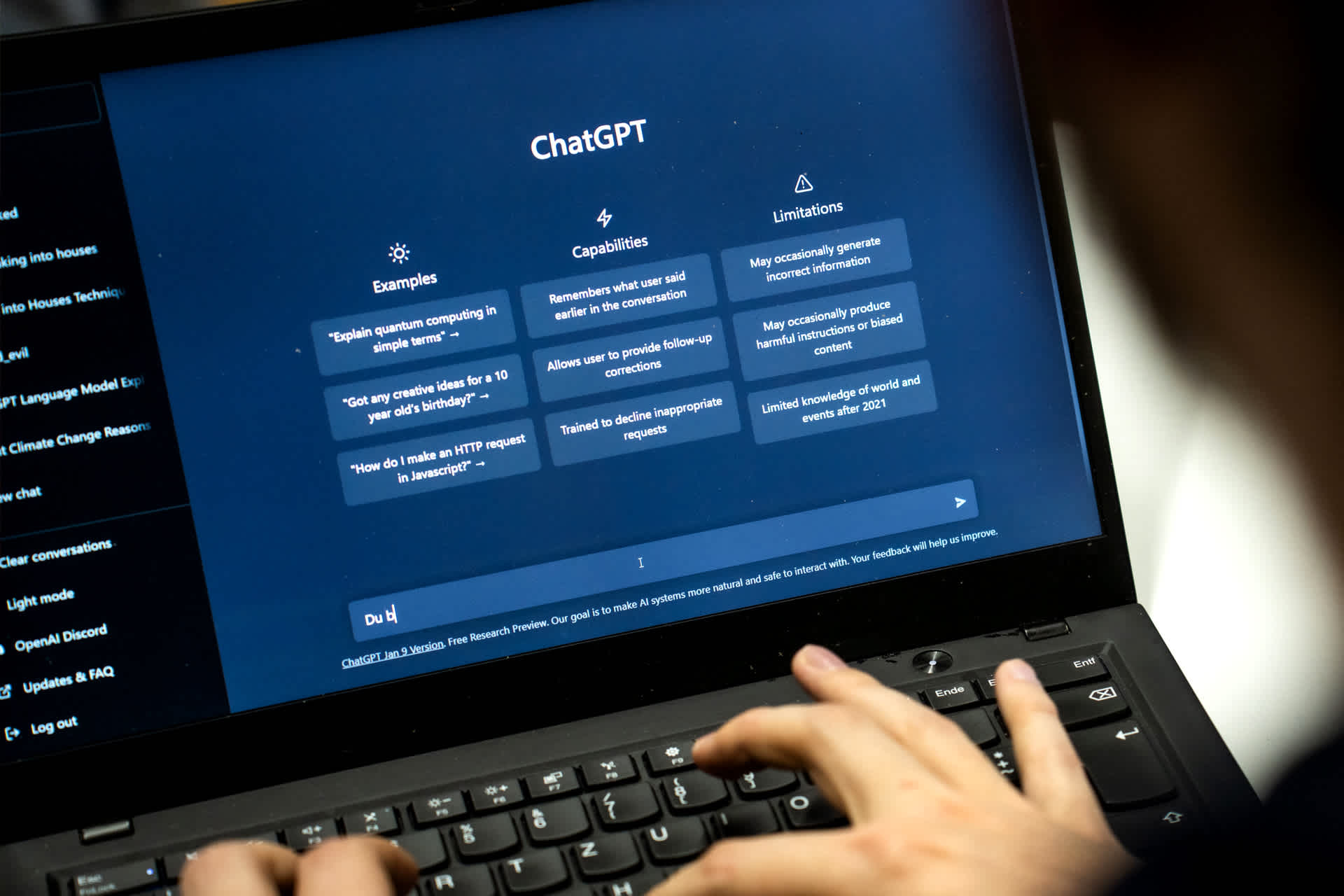 A person entering a term into ChatGPT on a laptop