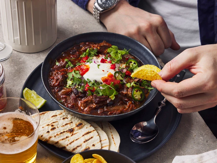 Beef chili with condiments