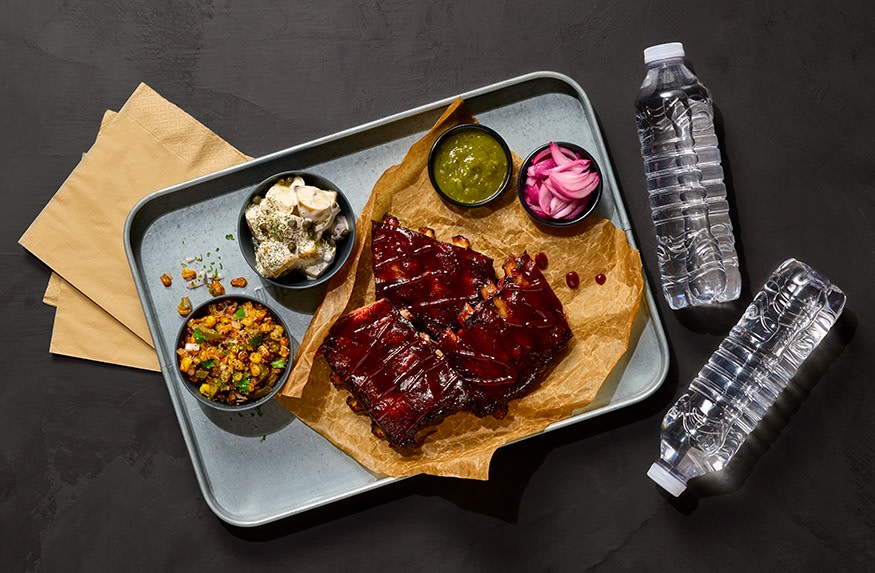 Sweet Chipotle glazed ribs with creamy potato salad, pickled onion, charred corn & salsa verde