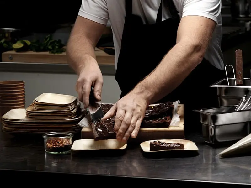 Chocolate brownies on paper plates