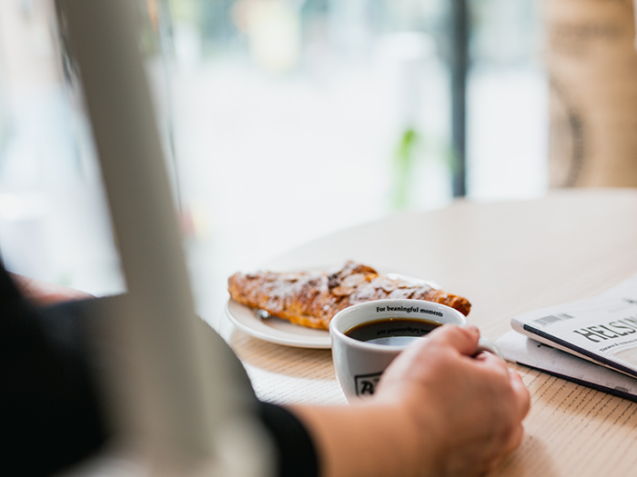 Image - cup of filter coffee and croissant