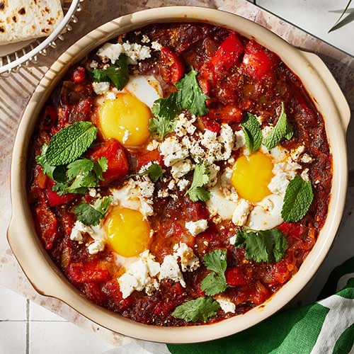 Cook greens in crushed tomatoes