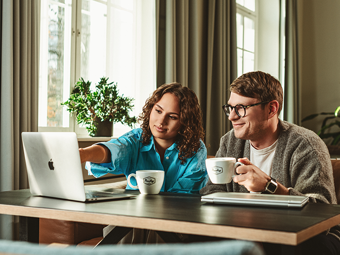 Employees working together and having coffee