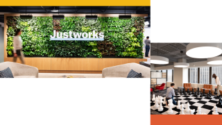 Justworks logo on a plant wall and employees playing chess