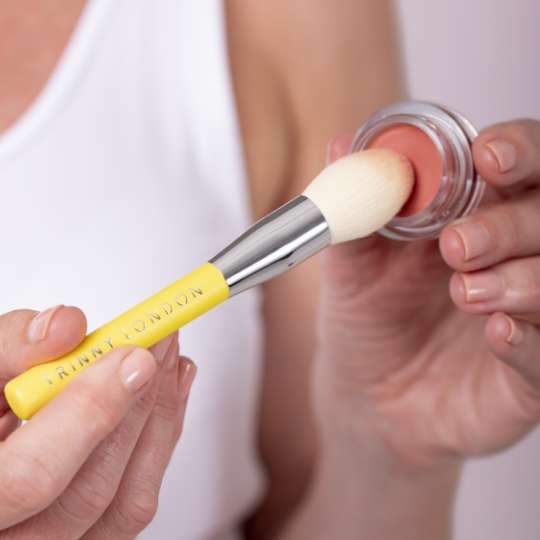 Should you apply your makeup with a brush or your fingers?