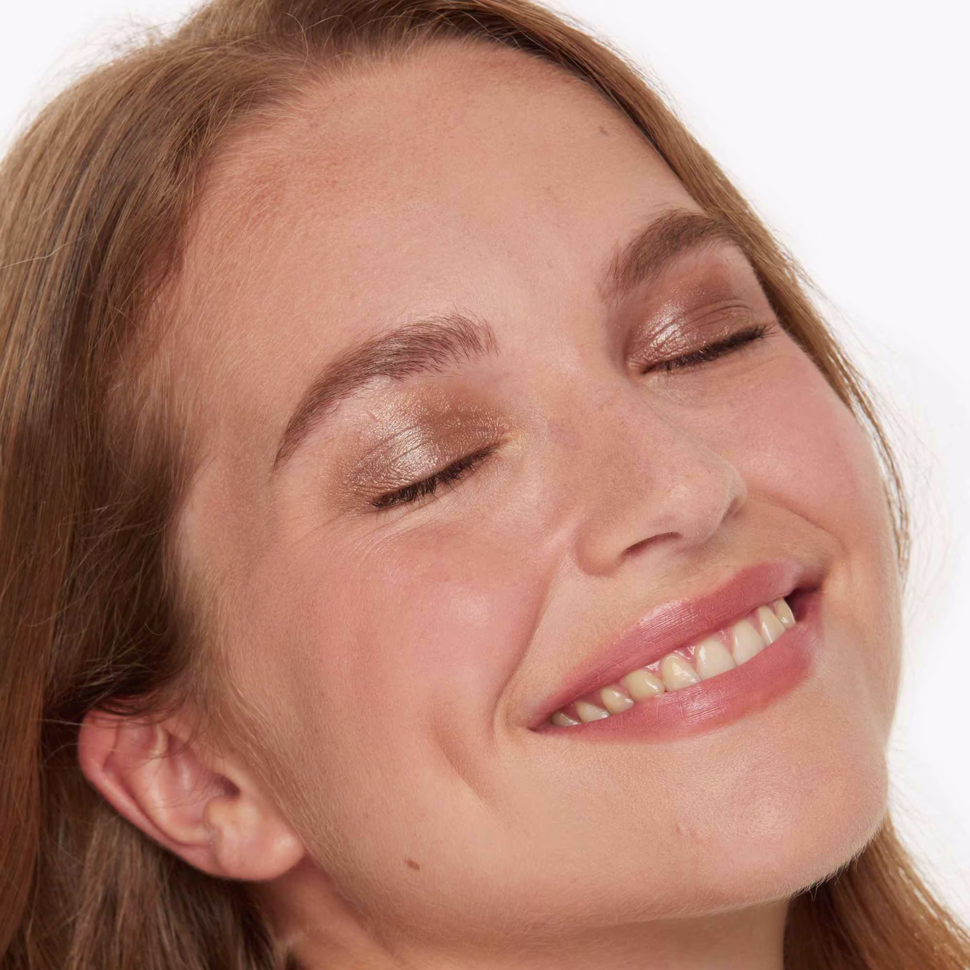 Izzy is wearing Lip & Cheek T-Tones in Lady J on her cheeks and lips and Eye2Eye T-Tones in Mystery.