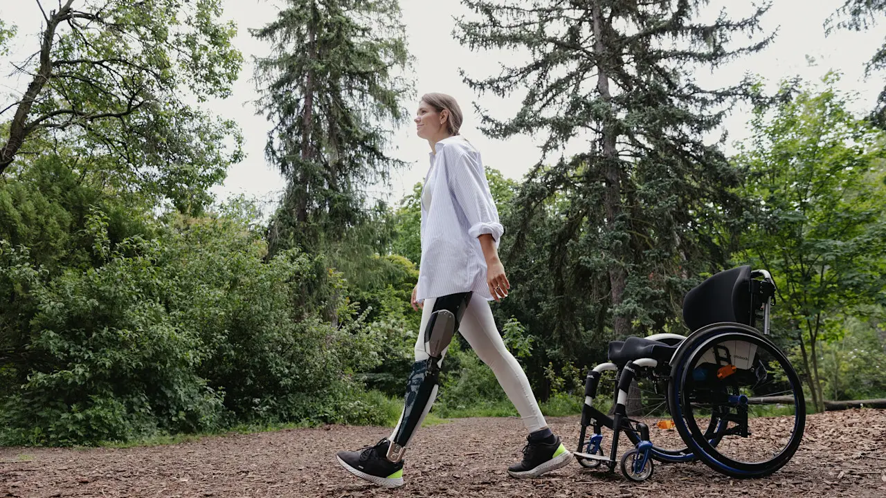An Ottobock C-Brace user walking outdoors