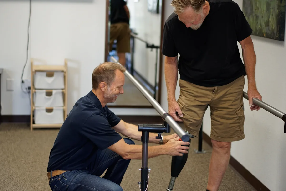 A Certified Prosthetist Orthotist of Artificial Limb Specialists Ottobock.care conducting gait training with an amputee patient