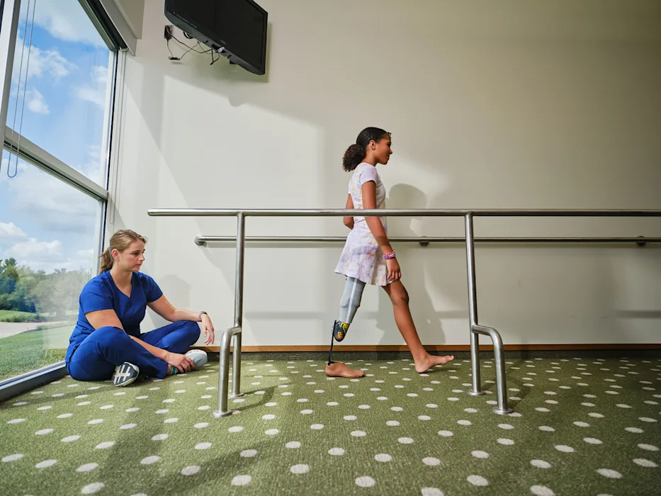 A pediatric patient conducting gait training with a Certified Prosthetist Orthotist (CPO)