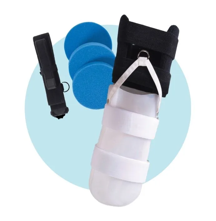 A practitioner applying a removable rigid liner to a new amputee receiving while lying in a bed post-operation