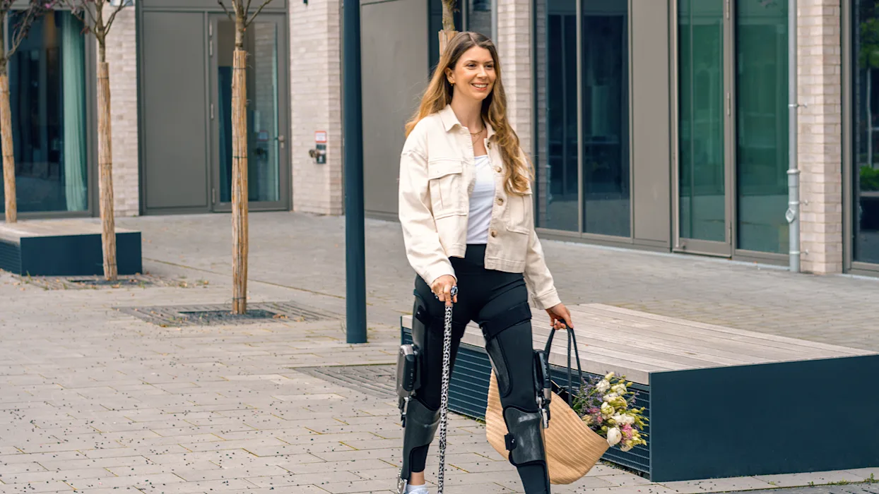 A person with a neurological condition that limits mobility walking with a bilateral C-Brace