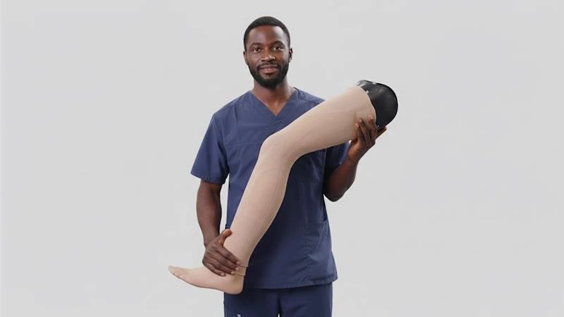 A prosthetic leg user walking on a rocky terrain on a beach