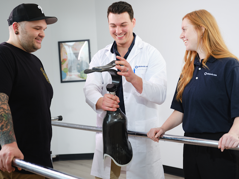 A Certified Prosthetist meeting with a lower limb amputee patient