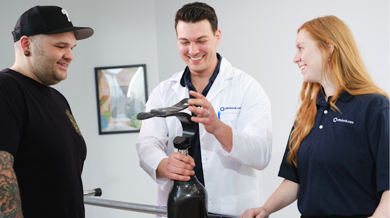 A Certified Prosthetist meeting with a lower limb amputee patient
