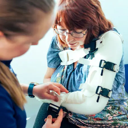 A clinician consulting a patient