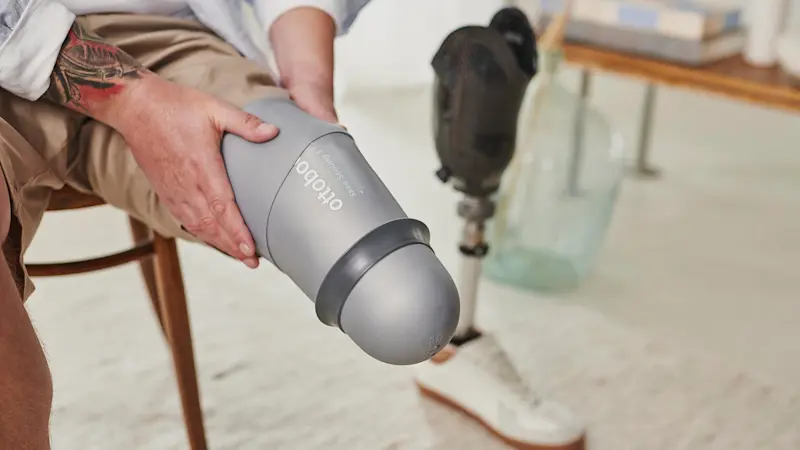 A prosthetic leg user preparing their prosthetic socket on their residual imb