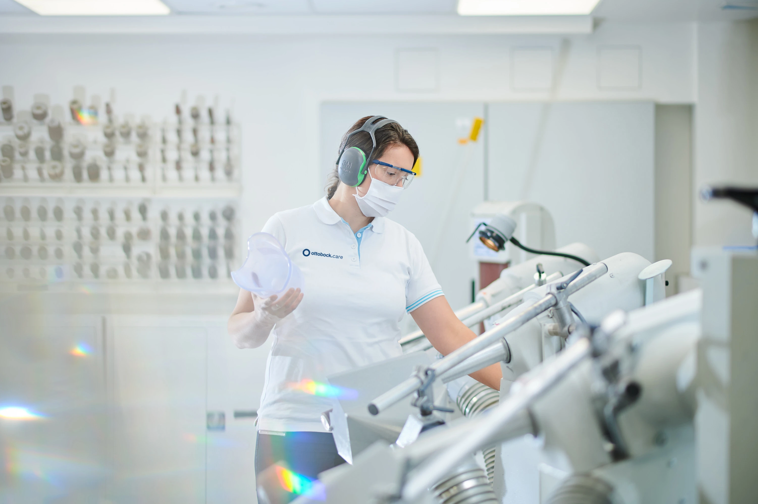 A Certified Prosthetist Orthotist working on a silicone prosthetic socket