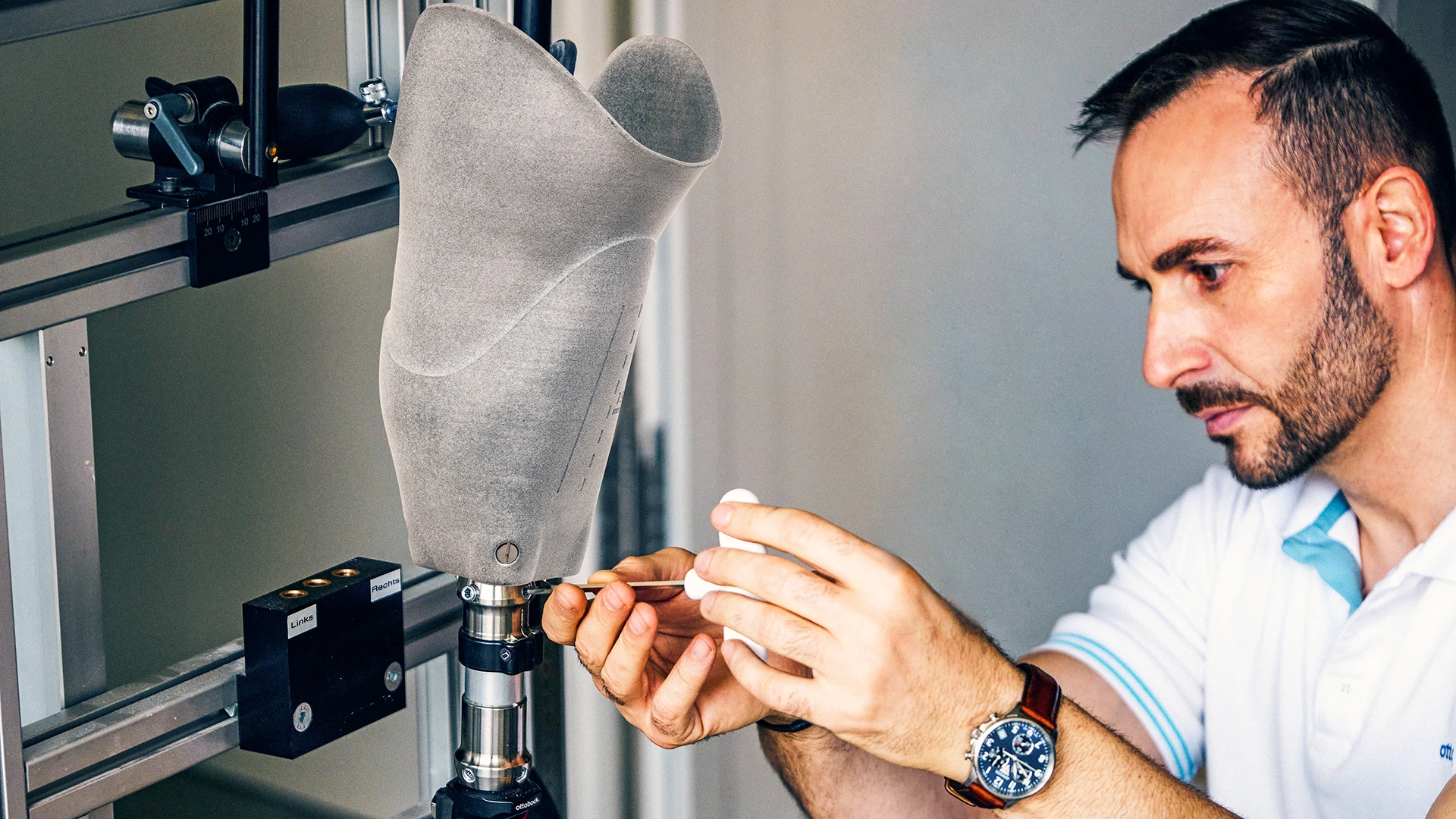 A certified prosthetist orthotist working on a prosthetic socket