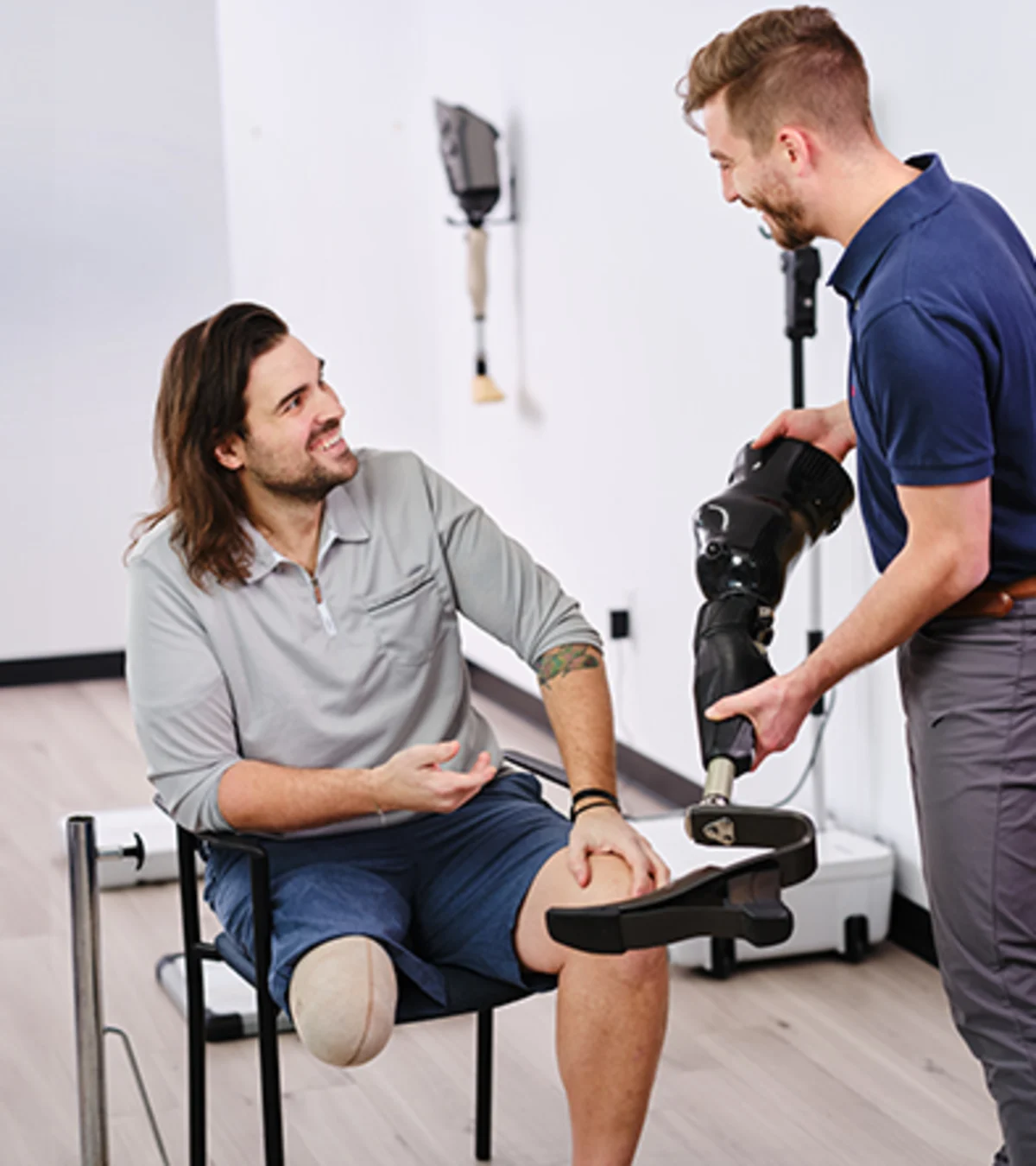 A Certified Prosthetist Orthotist consulting on prosthetic legs with a patient