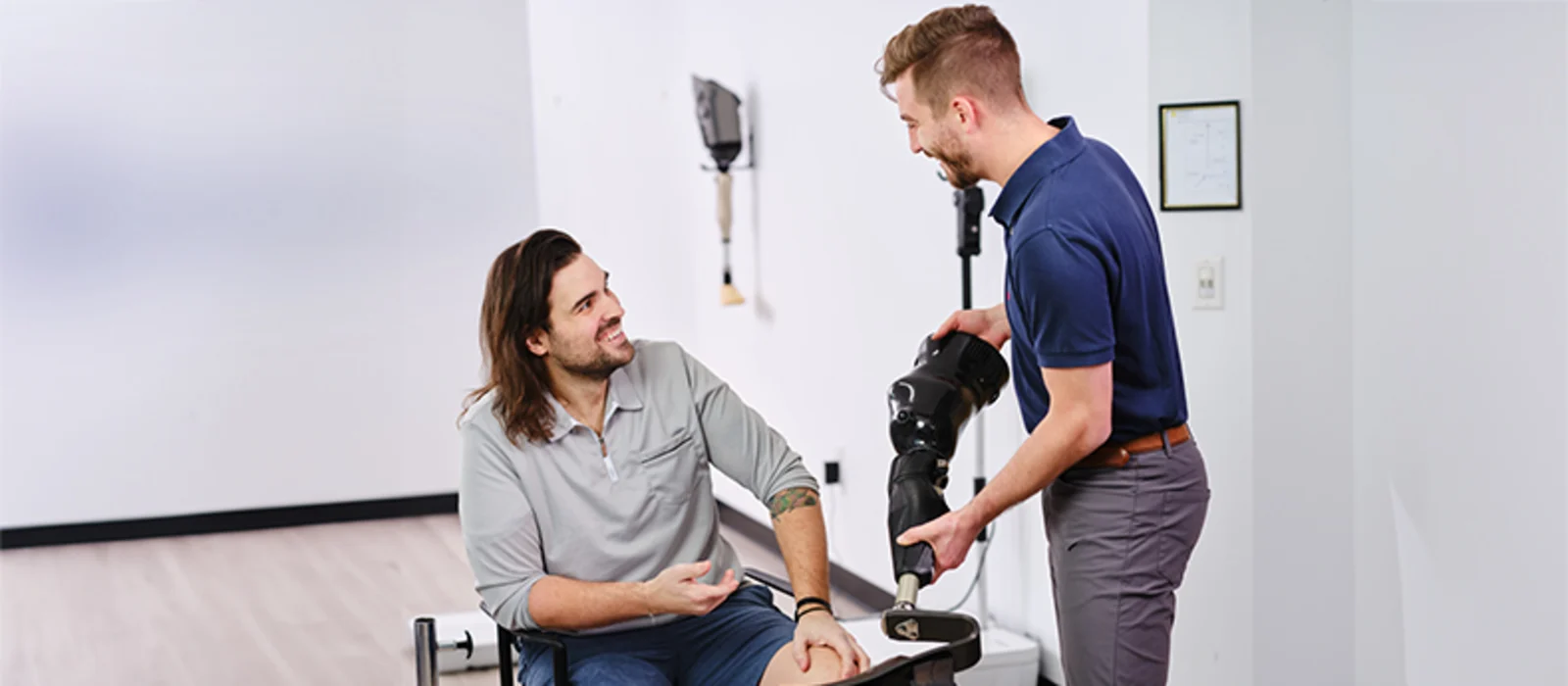 A Certified Prosthetist Orthotist consulting on prosthetic legs with a patient