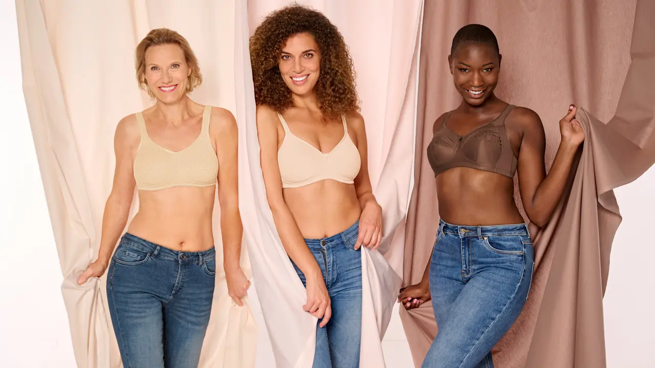 A woman at home in a customized support bra for post-mastectomy patients